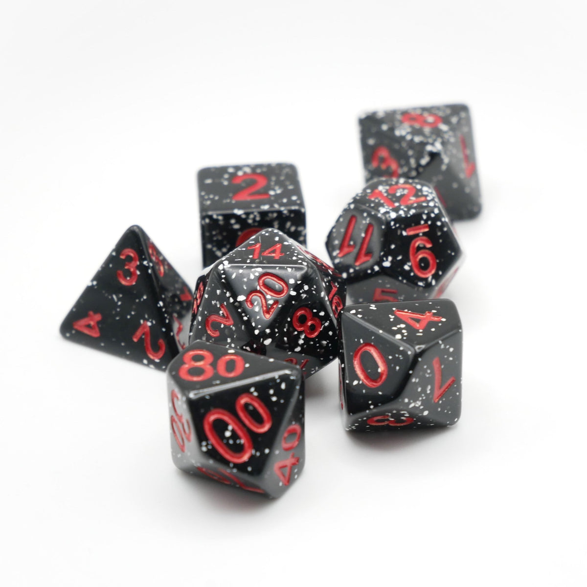 Black polyhedral dice set with red numbers on a white background