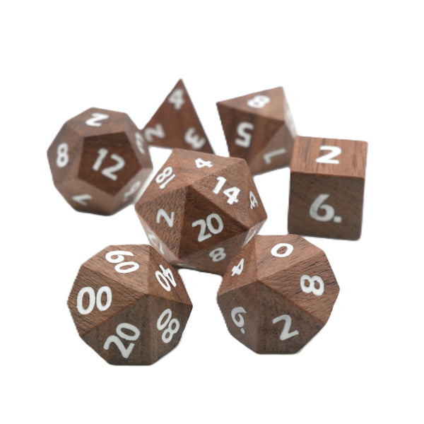 Wooden polyhedral dice set with white numbers on a white background
