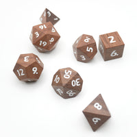 Wooden dice with white numbers on a white background