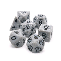 Set of gray polyhedral dice with black numbers on a white background