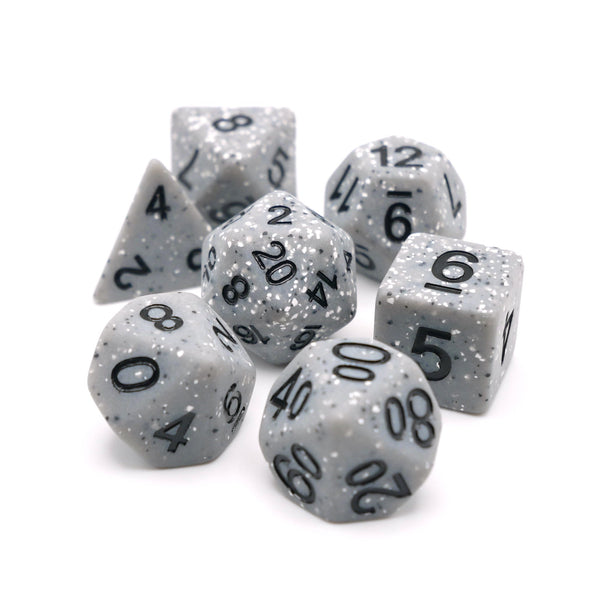 Set of gray polyhedral dice with black numbers on a white background