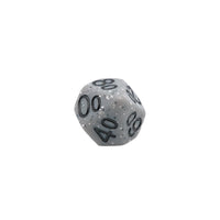 Close up of a single percentile d10 die in gray speckle with black numbers
