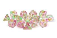 Set of colorful polyhedral dice with floral design on a white background
