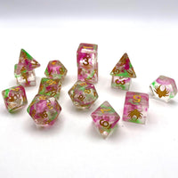 Set of colorful polyhedral dice with floral patterns on a white background