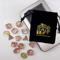 Set of colorful dice with a black drawstring bag featuring a logo and website text on a white background.