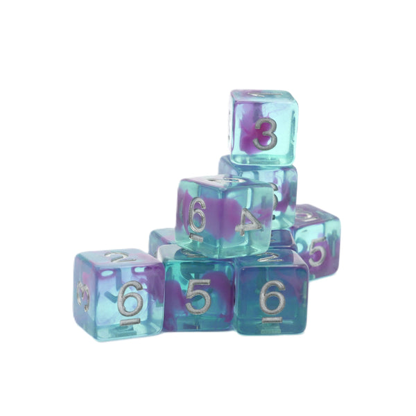 A stack of translucent polyhedral dice in a blue-to-purple gradient with silver-colored raised numerals, set against a plain white background.