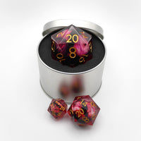 Giant red and black d20 in a silver tin with two smaller d20 dice beside it