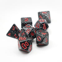 Black polyhedral dice set with red numbers on a white background