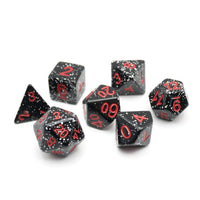 Set of black polyhedral dice with red numbers on a white background