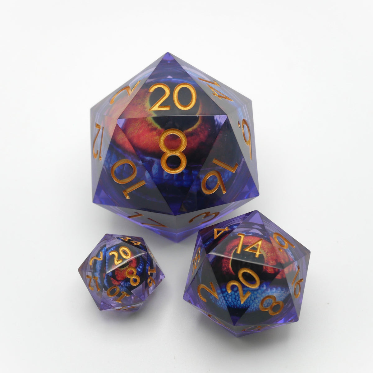Three translucent purple polyhedral dice with gold-colored numerals and a red and blue eye design inside, displayed on a clean white background.