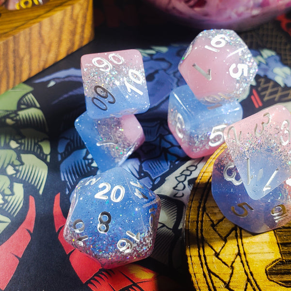 Elemental Glimmer d20 and d10 dice close up on a patterned mat