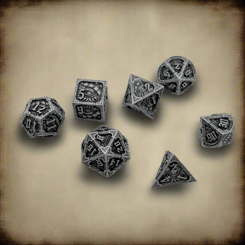 A set of seven silver-toned polyhedral RPG dice with dark engraved details and occult symbols, arranged on a textured beige parchment background.