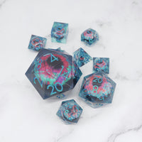 Set of colorful polyhedral dice on a marble surface