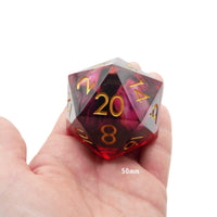 Polyhedral dice with red and clear sides held in a hand, showing '20' on one face.
